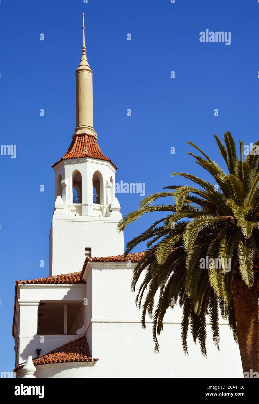 Close up of the red spanish tile roof with the cupola and Spire in