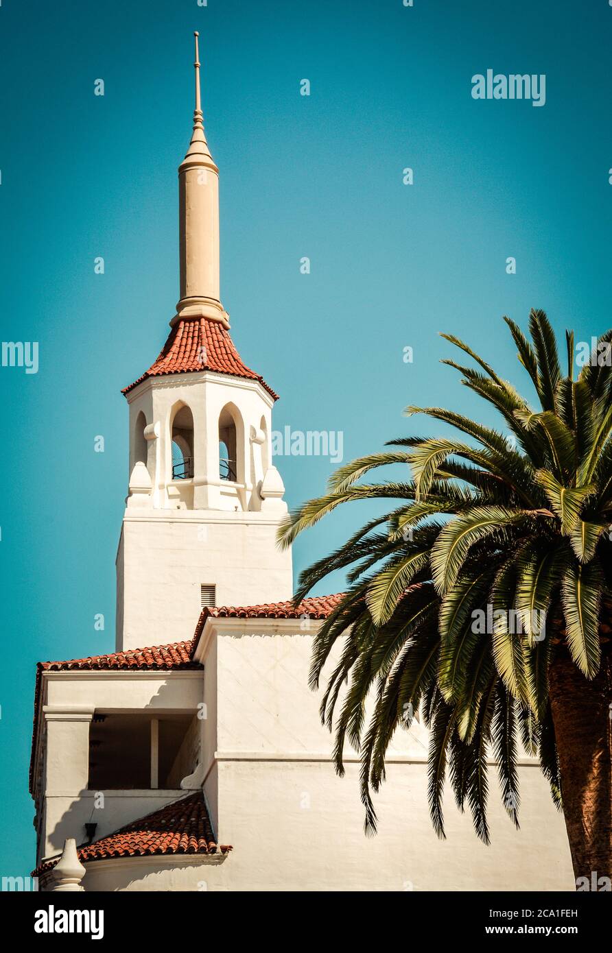 Close up of the red spanish tile roof with the cupola and Spire in