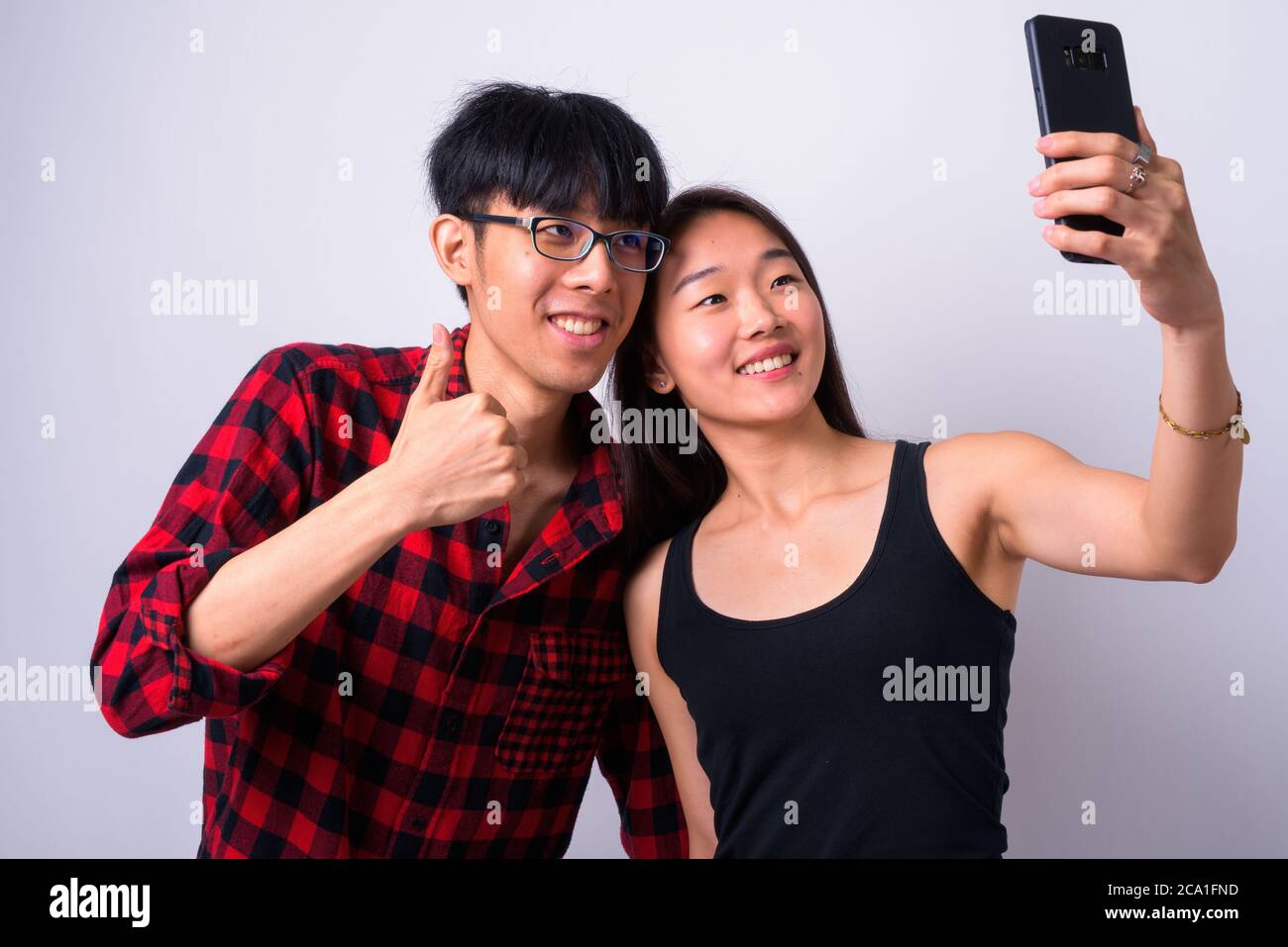 Two handsome asian women taking hi-res stock photography and images - Alamy