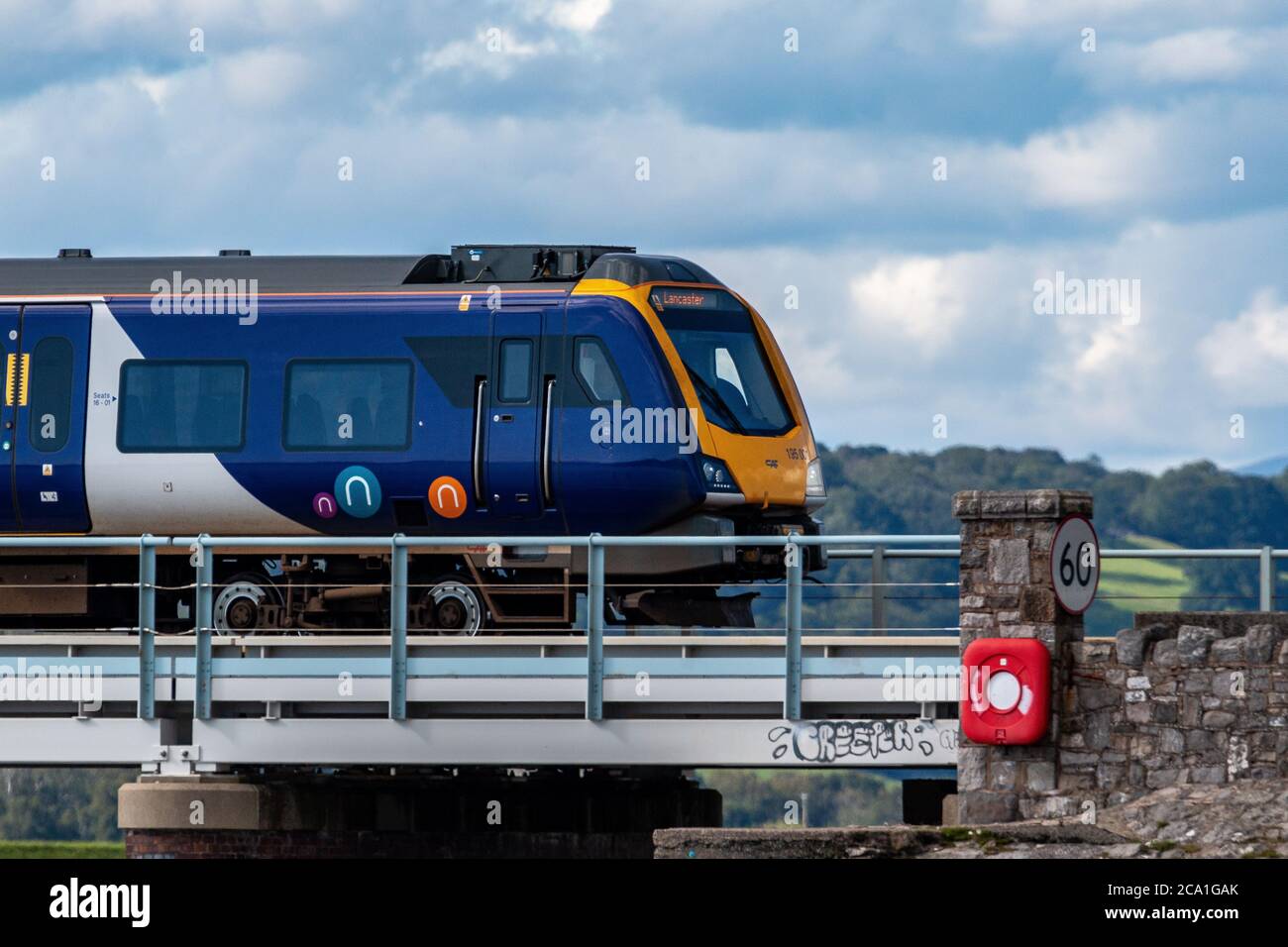 Arnside, Cumbria, United Kingdom. 3rd Aug, 2020. British Rail Class 195 Diesel train travelling over Arnside Viaduct in the afternoon sunshine over the River Kent The £500m 25 two car Trains and 33 Triple car units were ordered with the first units being delivered a year ago in July 2020, the trains where transferred to Northern Trains on 1 March 2020. The firm, is owned by Arriva Rail North. Credit: PN News/Alamy Live News Stock Photo