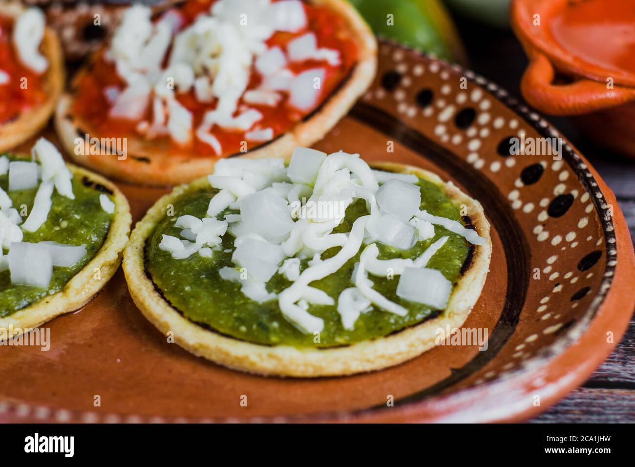 Sopes Shells Mexican sopes with grated cheese and salsa, Traditional breakfast in ...