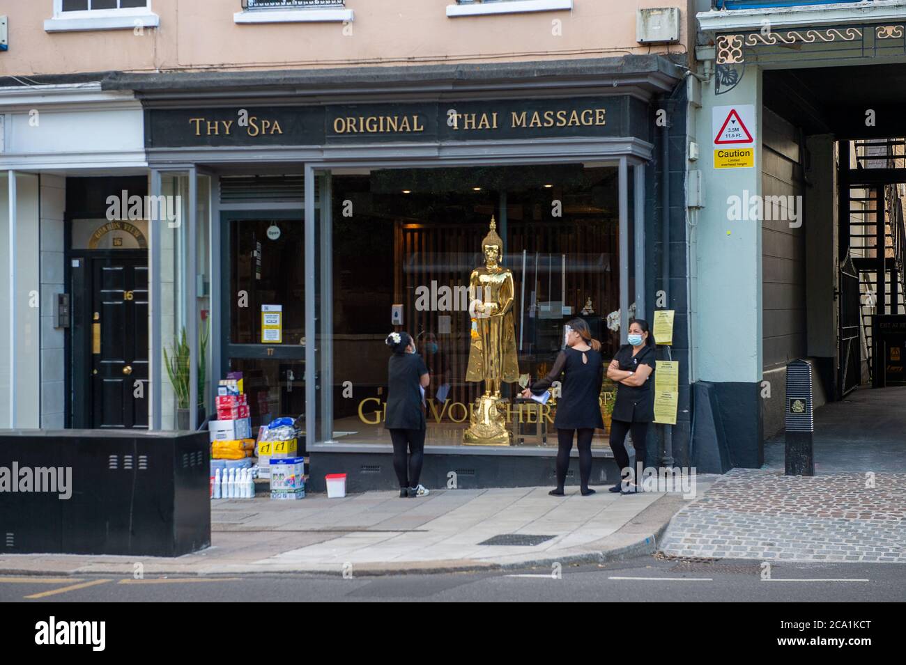 Windsor, Berkshire, UK. 3rd August, 2020. Staff wait outside the Thy Spa Thai Massage parlour in Windsor with cleaning materials. Credit: Maureen McLean/Alamy Stock Photo