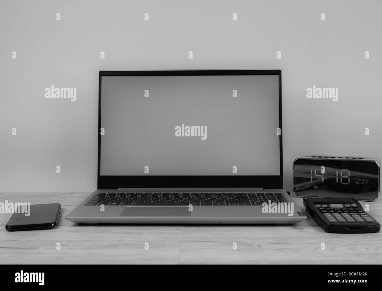 Laptop computer with a white screen on the desktop, blue background ...