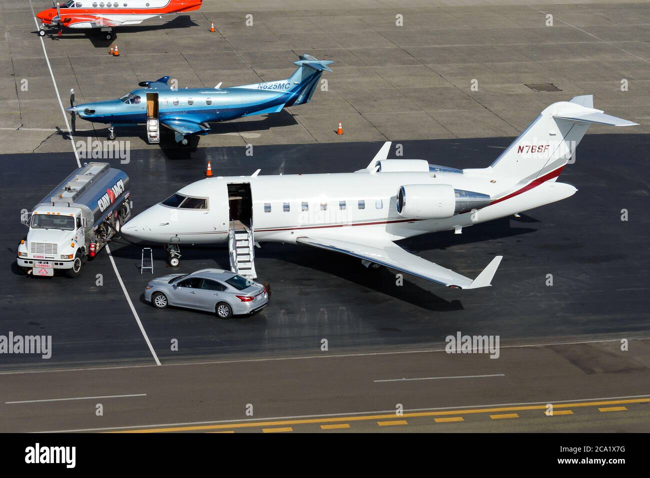 Bombardier CL-600 Challenger 650 at King County Airport. Private jet refueling for luxury transportation. Car for VIP transport and business jet. Stock Photo