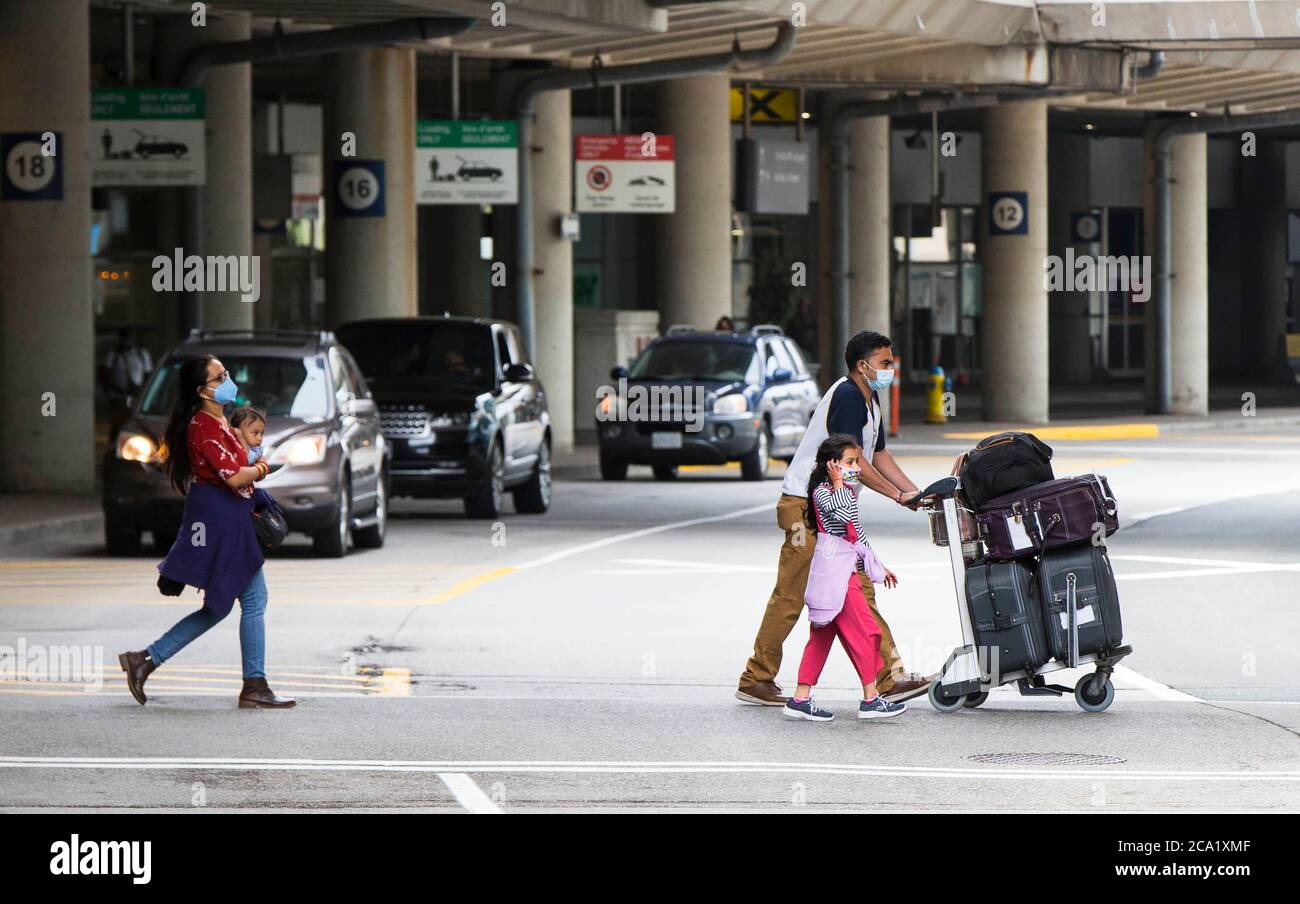 Toronto, Canada. 3rd Aug, 2020. People are seen at the international passenger pickup area outside Terminal 3 of Pearson International Airport in Toronto, Canada, on Aug. 3, 2020. Travel restrictions in Canada will be extended until Aug. 31 to reduce the spread of COVID-19. Credit: Zou Zheng/Xinhua/Alamy Live News Stock Photo