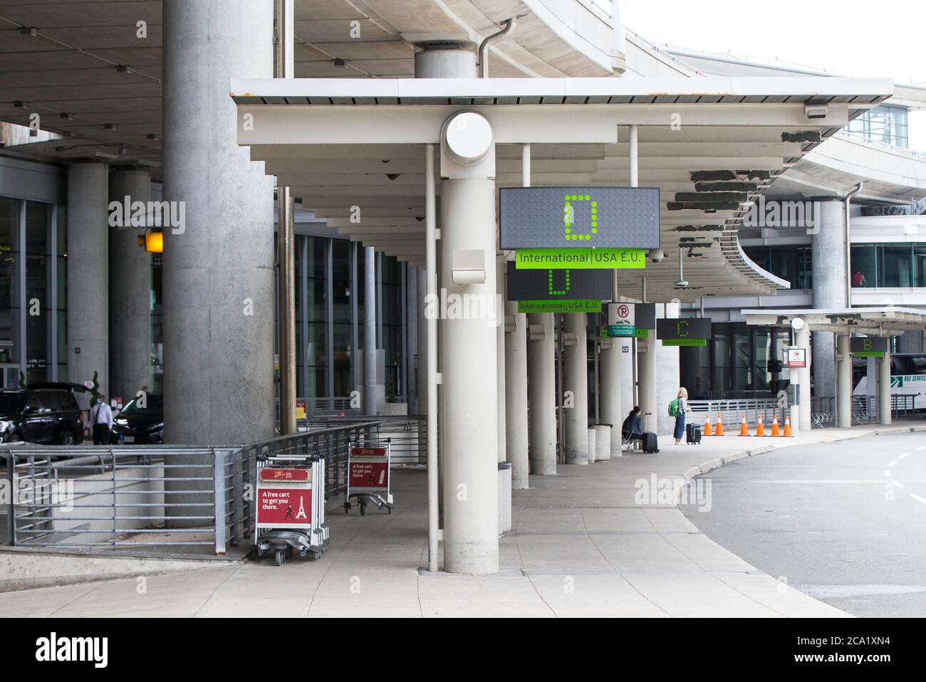 Toronto, Canada. 3rd Aug, 2020. Few people are seen at the international passenger pickup area outside Terminal 1 of Pearson International Airport in Toronto, Canada, on Aug. 3, 2020. Travel restrictions in Canada will be extended until Aug. 31 to reduce the spread of COVID-19. Credit: Zou Zheng/Xinhua/Alamy Live News Stock Photo