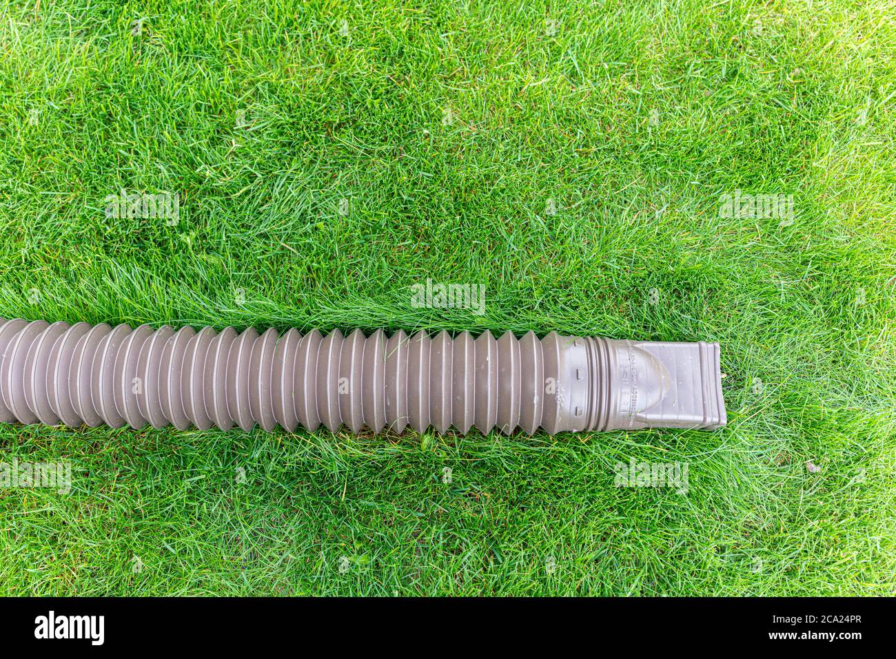 Water drainage pipe from roof to remove water during rainfall Stock