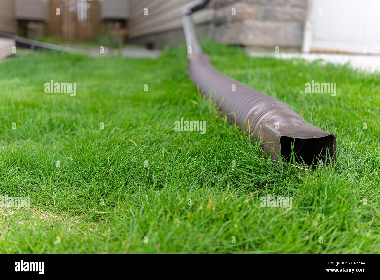 Water drainage pipe from roof to remove water during rainfall Stock