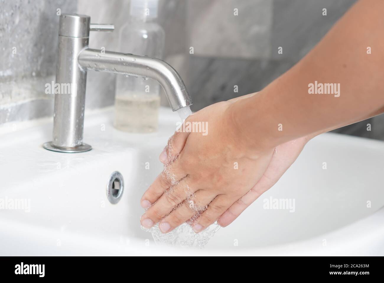 Hands washing for prevention of novel Coronavirus Disease 2019 or COVID-19 . Stock Photo