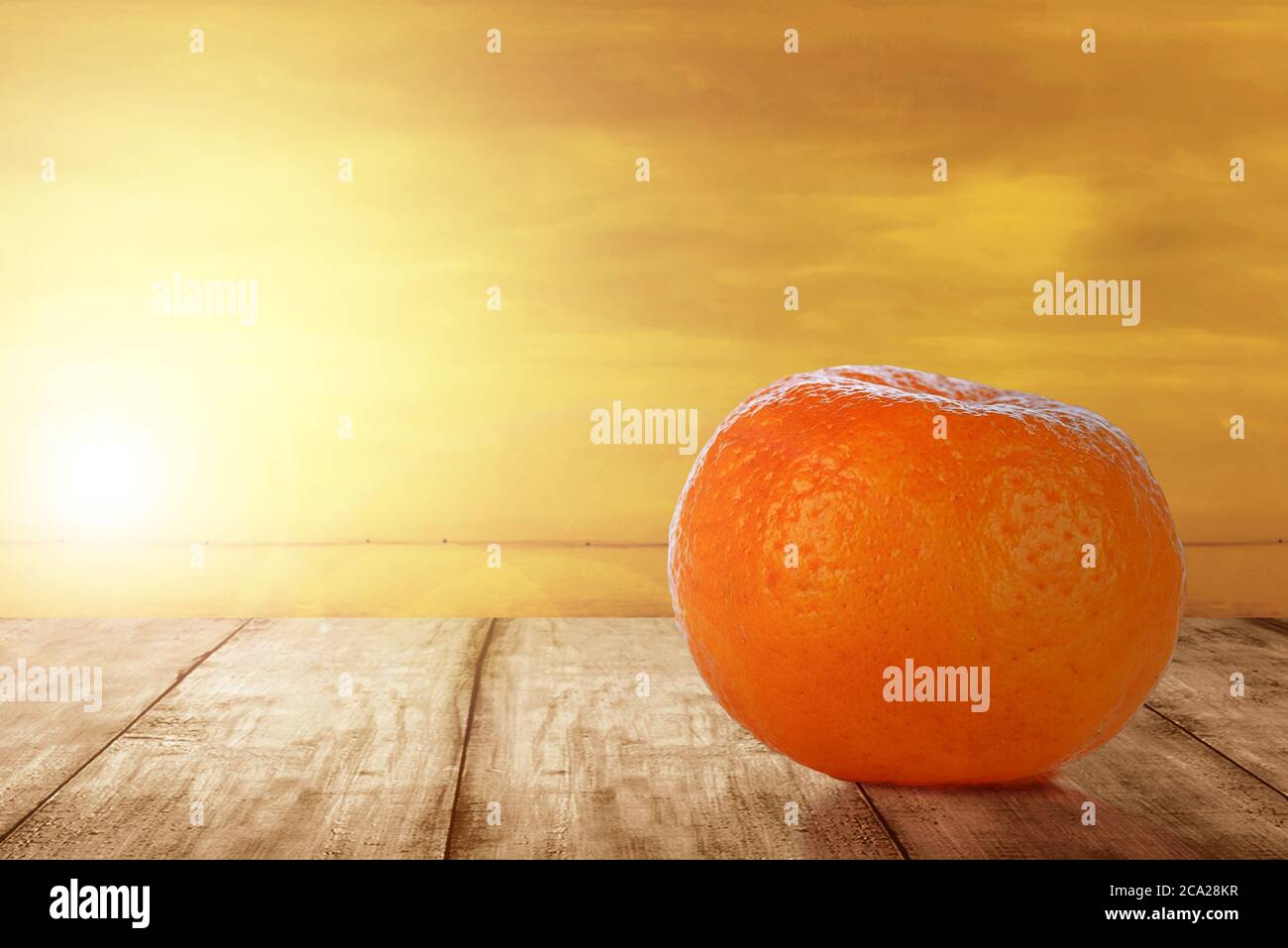 Oranges fruit on the table with a sunset sky background Stock Photo - Alamy