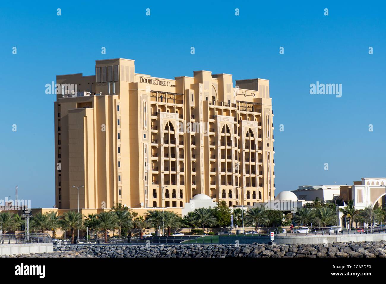 'Ras al Khaimah, Ras al Khaimah/United Arab Emirates - 2/14/2020: 'Hilton Double Tree Hotel building sign against blue sky background Marjan Island ' Stock Photo