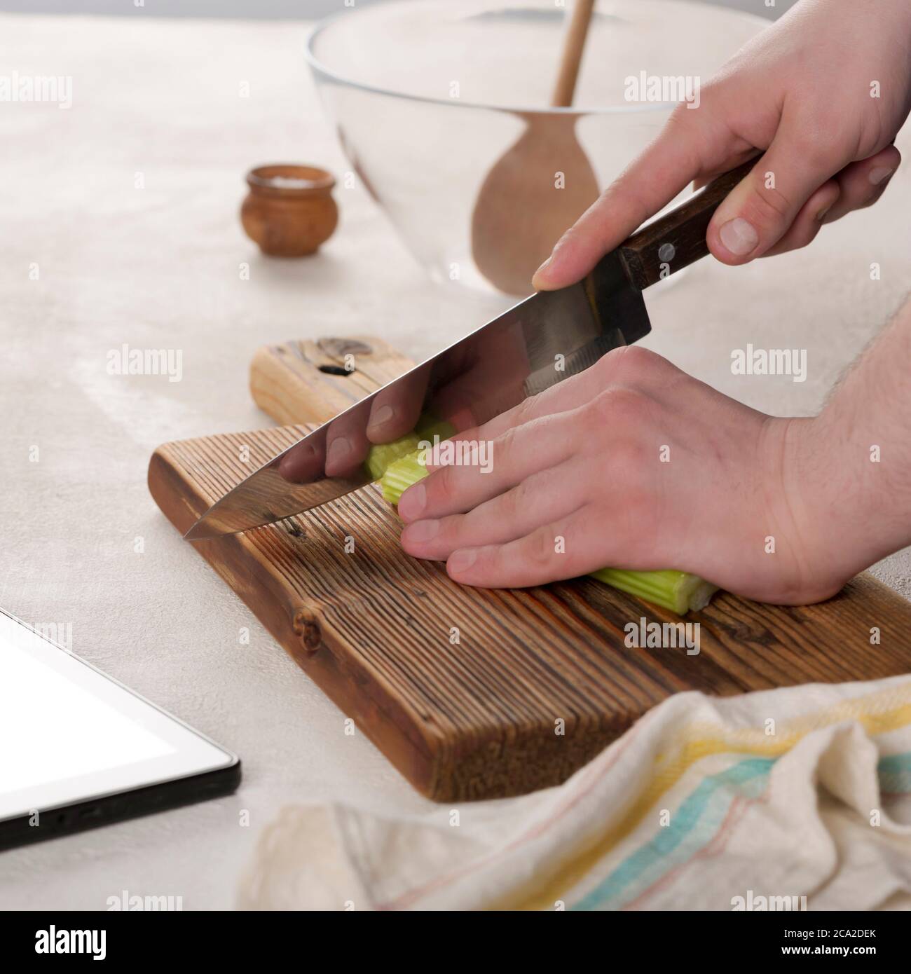 knife cutting, vegetable salad, restaurant kitchen, young caucasian