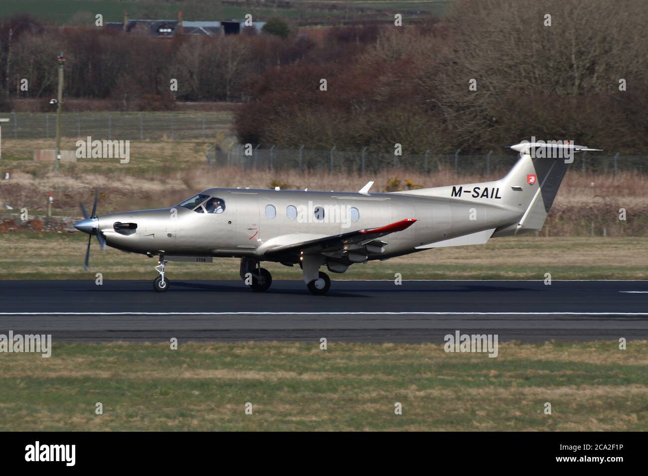 M-SAIL, a privately-owned Pilatus PC-12/47E, landing at Prestwick Airport in Ayrshire, Scotland. Stock Photo