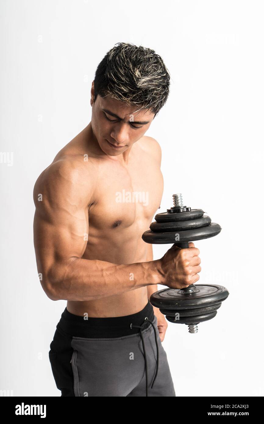 Young man muscles lift barbell weights with energy in the biceps on white background Stock Photo