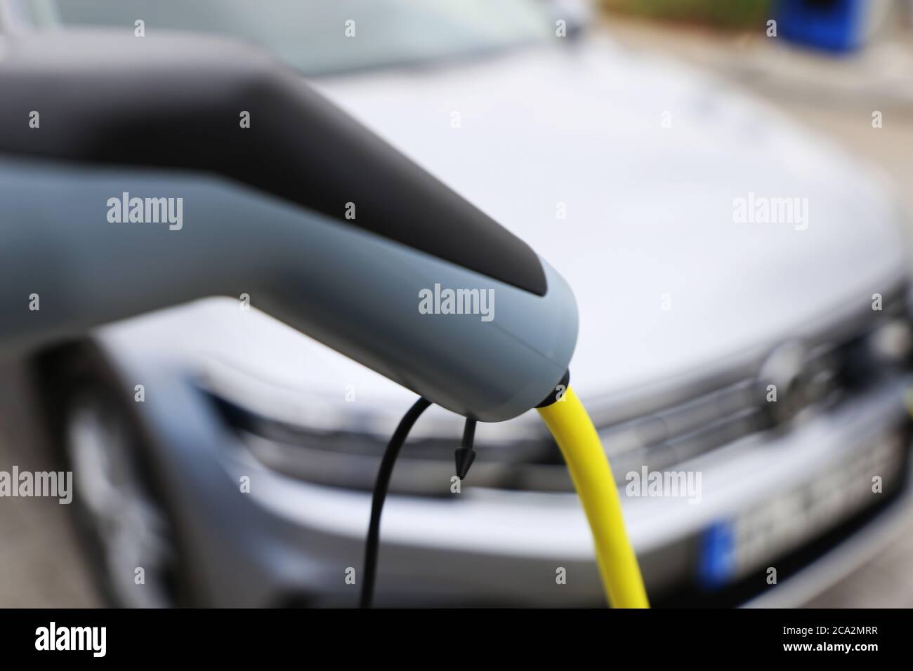 Electric car at the charging station Stock Photo