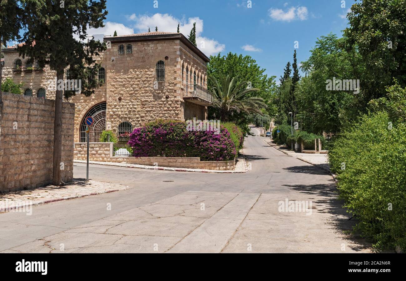 an empty street in the historic yemin moshe neighborhood of jerusalem during the Coronavirus pandemic of 2020 showing nineteenth century buildings Stock Photo