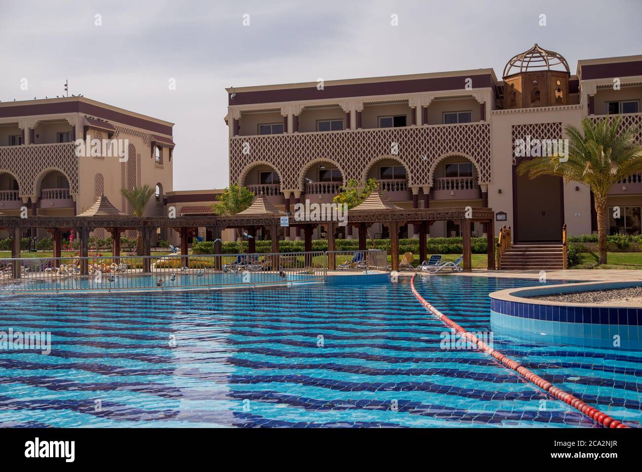 a pool with blue water in an Arab hotel Stock Photo - Alamy