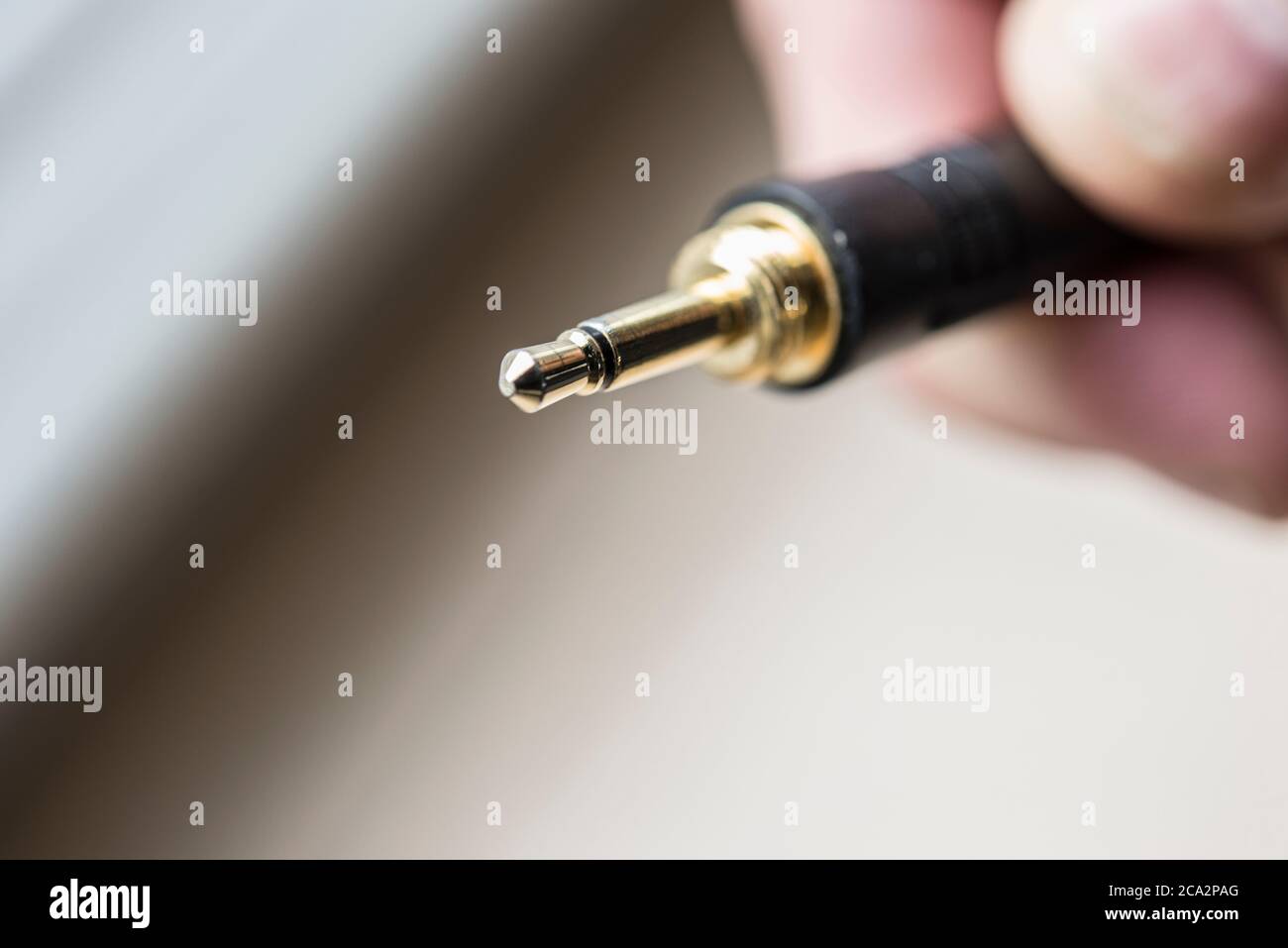 Tip Sleeve microphone jack held in hand isolated Stock Photo Alamy