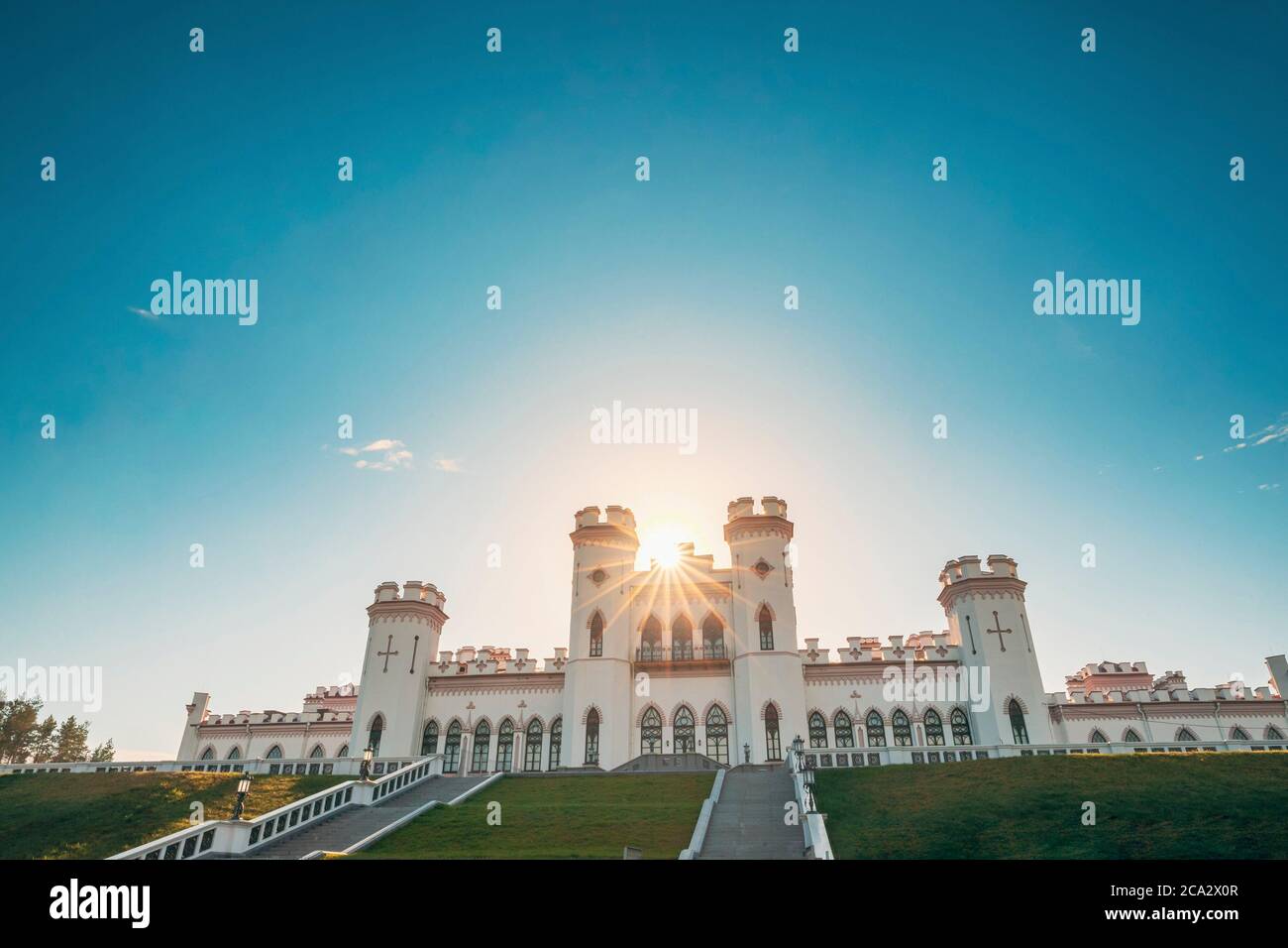 Kosava, Belarus. Summer Sun Shine Above Kosava Castle. It Is A Ruined Castellated Palace In Gothic Revival Style. Puslowski Palace Castle. Landmark Stock Photo