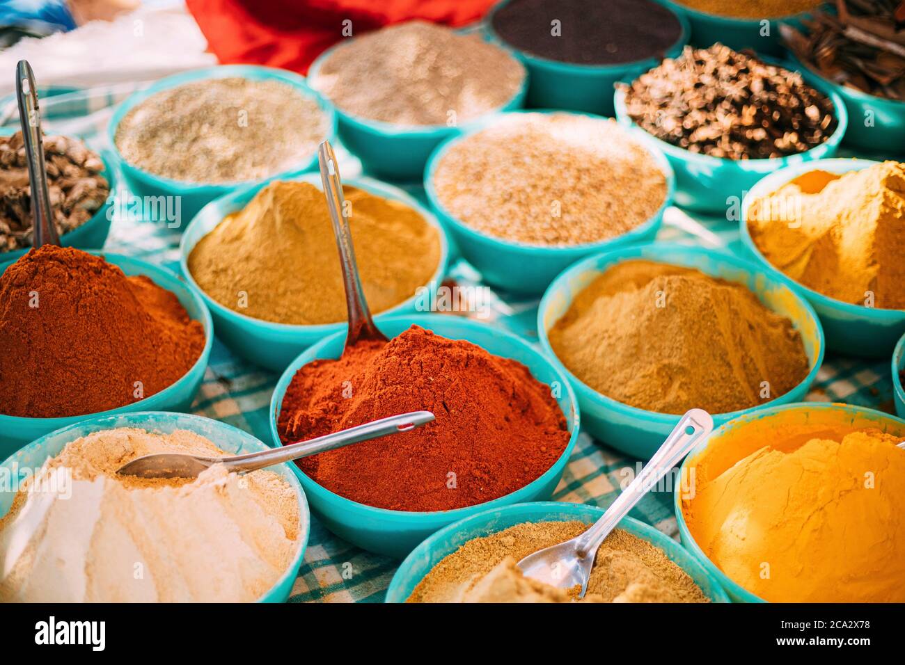 Close View Of Masala Curry, Bright Colors Fragrant Seasoning, Condiment In Tray On Local Food Market, Bazaar. Popular Souvenirs From India. Stock Photo