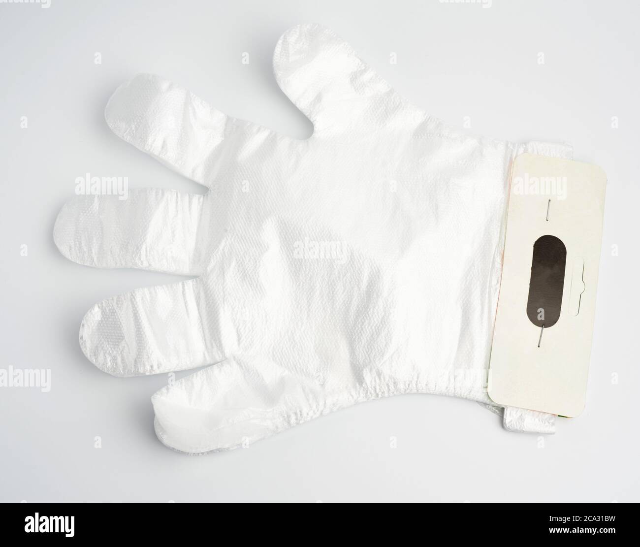 disposable polyethylene gloves on a white background, top view, flat lay. Stock Photo