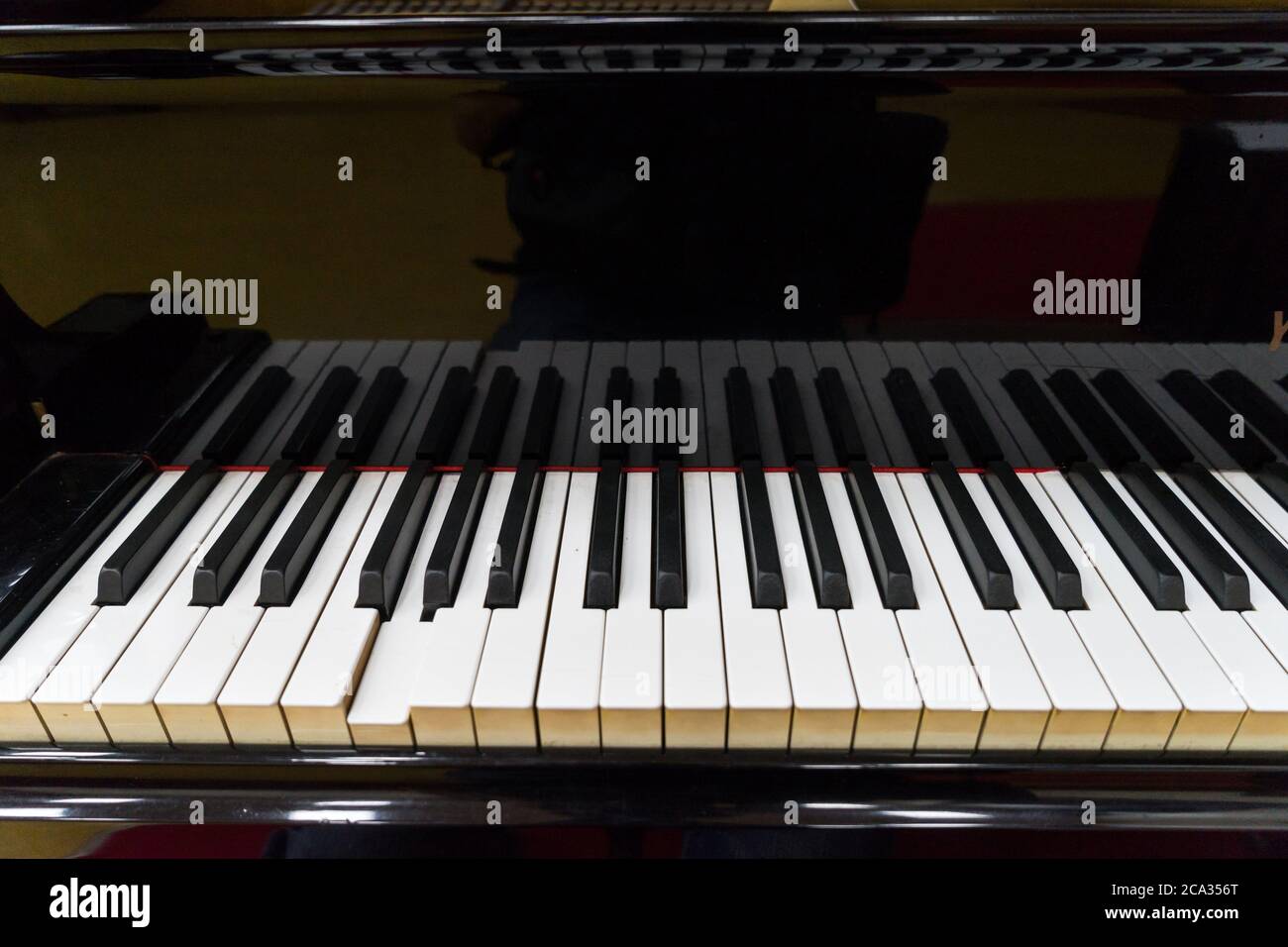 Keyboard of an automatic piano Stock Photo - Alamy