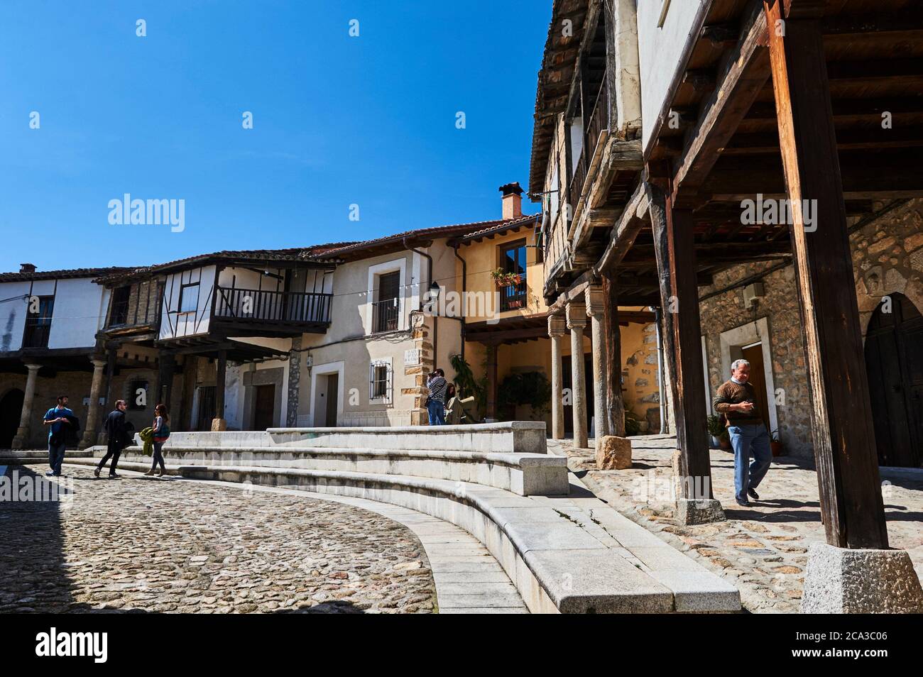 People visiting the medieval square in Cuacos de Yuste, Extremadura (Spain) Stock Photo