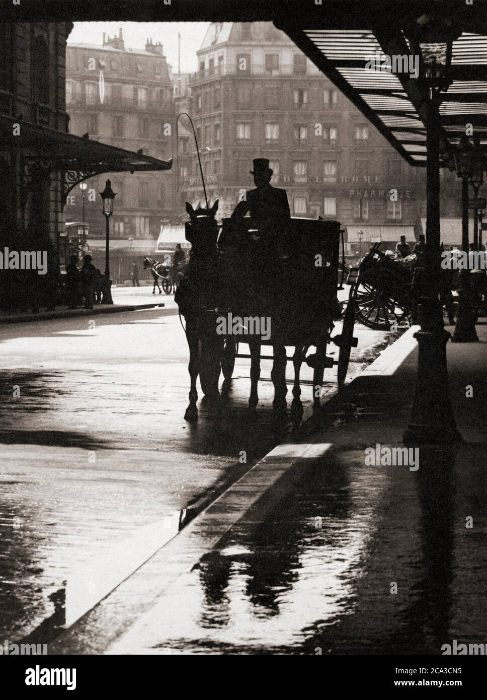 Horse and coach at St. Lazare, Paris, circa 1905. After a photograph possibly by A. Roussel. Stock Photo