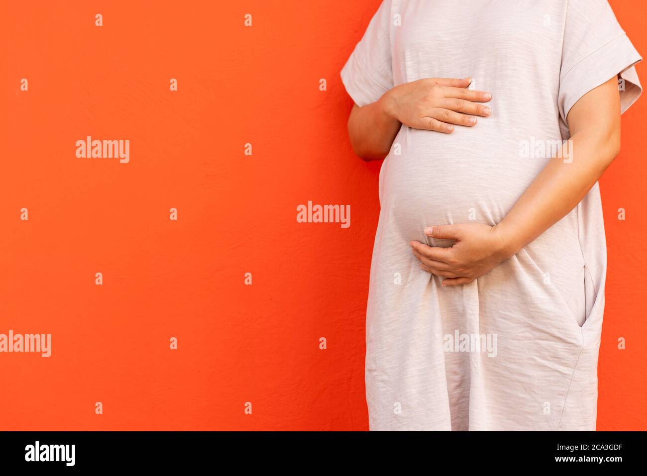 Happy pregnant woman and expecting baby at home. Stock Photo