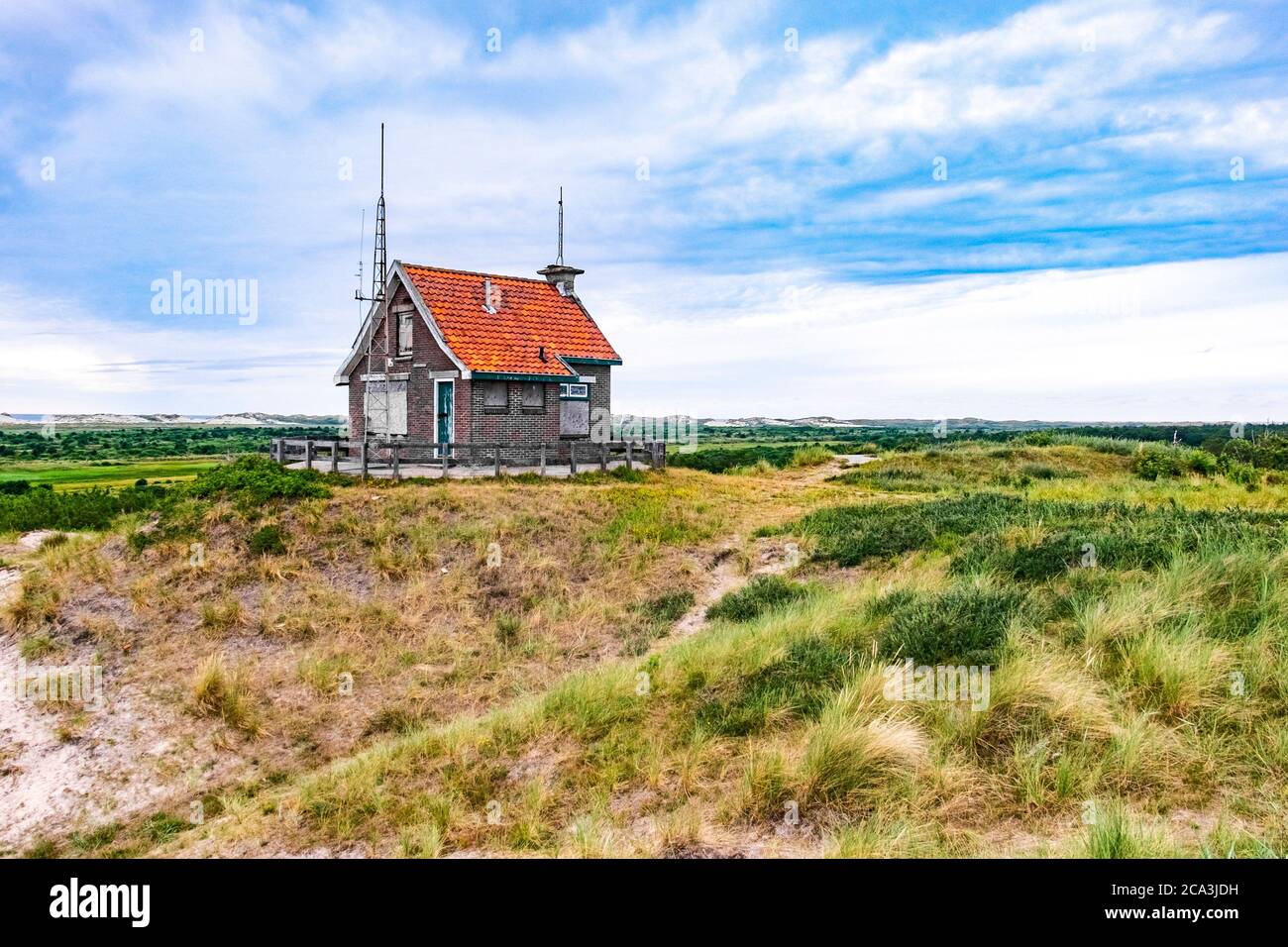 Little uninhabited house on the hills with view on the wadden sea on Frisian Island Terschelling, The Netherlands, Europe. Stock Photo