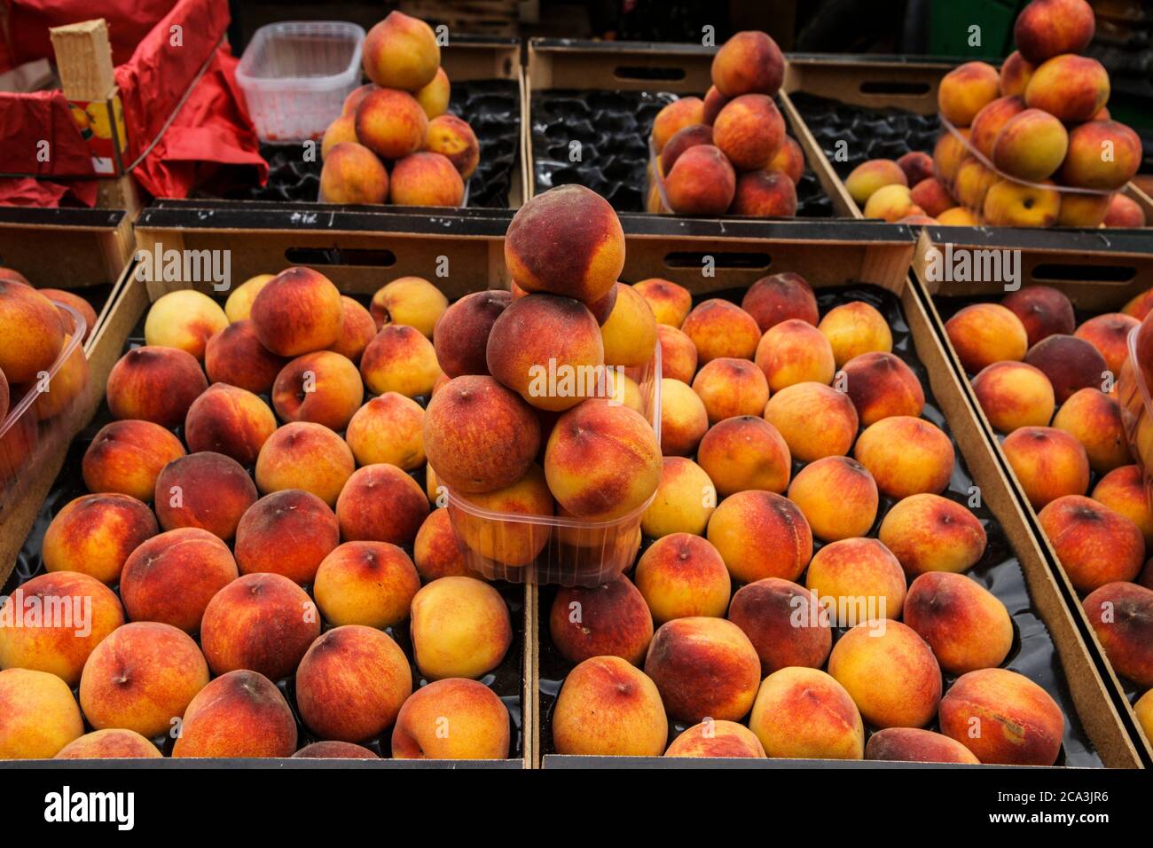 Peach fruit stand. The delightful, colorful street markets of Palermo