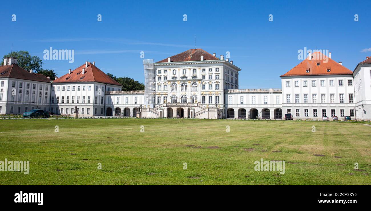 Nymphenburg Palace with grass in the foreground. A Must See on the agenda of every tourist of Munich. No people. Stock Photo