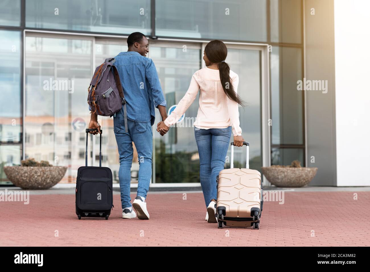 Going To Travel. Black Couple Holding Hands, Entering Airport Terminal ...