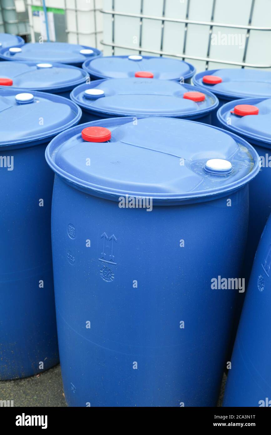 Chemical Plant, Plastic Storage Drums outdoor toxic barrel Stock Photo