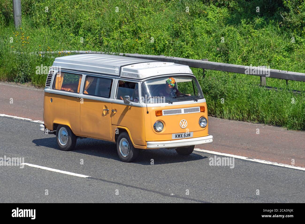 1975 70s cream white VW Volkswagen Caravans and Motorhomes, campervans on Britain's roads, RV leisure vehicle, family holidays, caravanette vacations, Touring caravan holiday, kombi van conversions, Vanagon autohome, Dormobile life on the road, Stock Photo