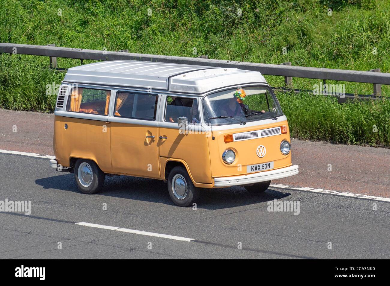1975 70s cream white VW Volkswagen Caravans and Motorhomes, campervans on Britain's roads, RV leisure vehicle, family holidays, caravanette vacations, Touring caravan holiday, kombi van conversions, Vanagon autohome, Dormobile life on the road, Stock Photo