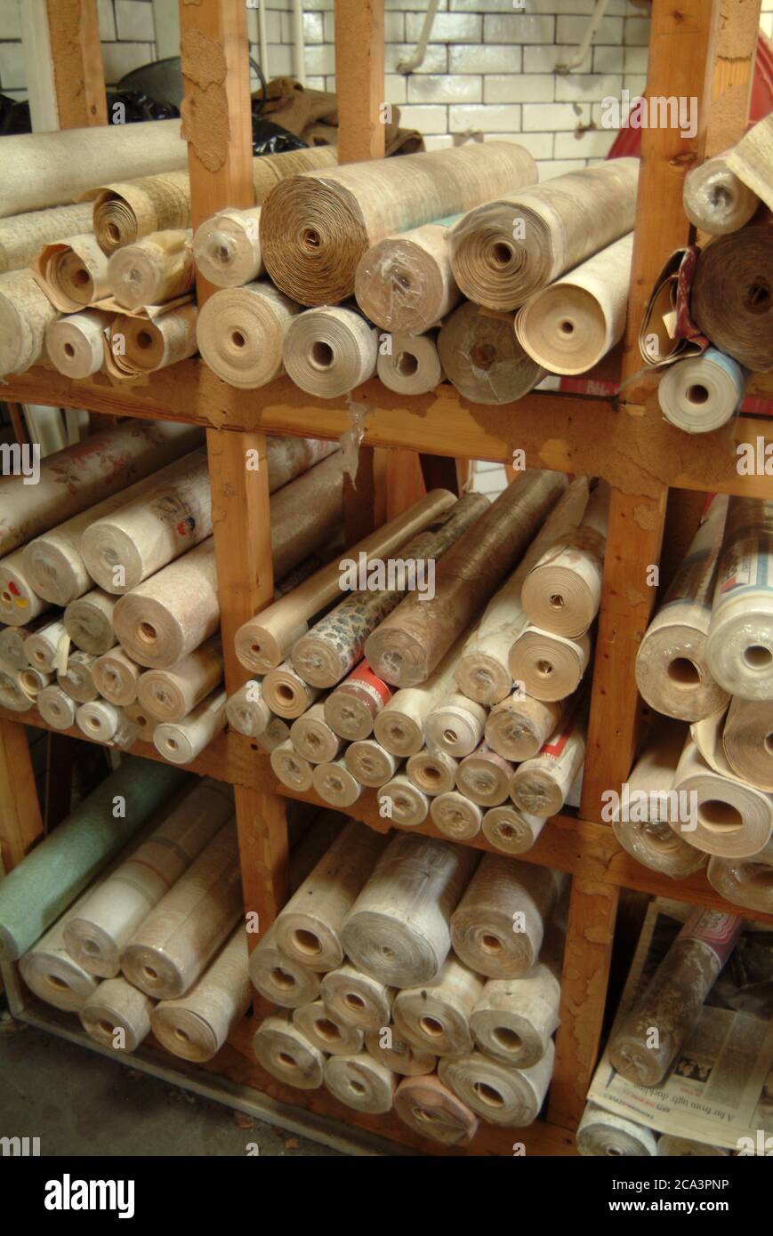 wallpaper rolls on rack Stock Photo
