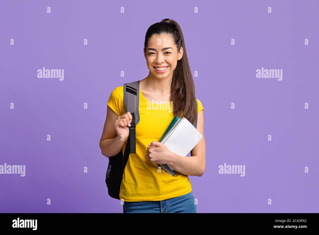 Education Concept. Asian student girl with workbooks and backpack ...