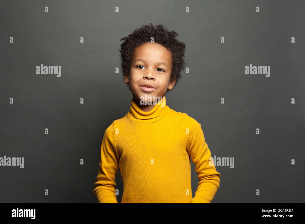 Curious black child boy ob black portrait Stock Photo