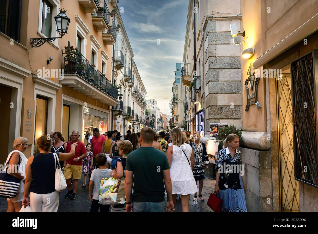 Taormina, ME, Italy, August 9, 2019: A crowd of tourists strolling along Corso Umberto in the historic center of Taormina in Sicily, Italy Stock Photo