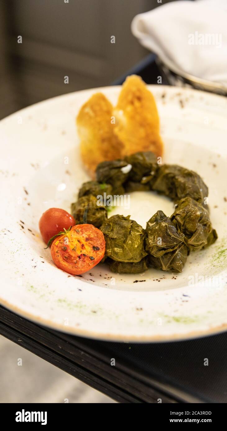 Dolma meat meal with tomato close up Stock Photo