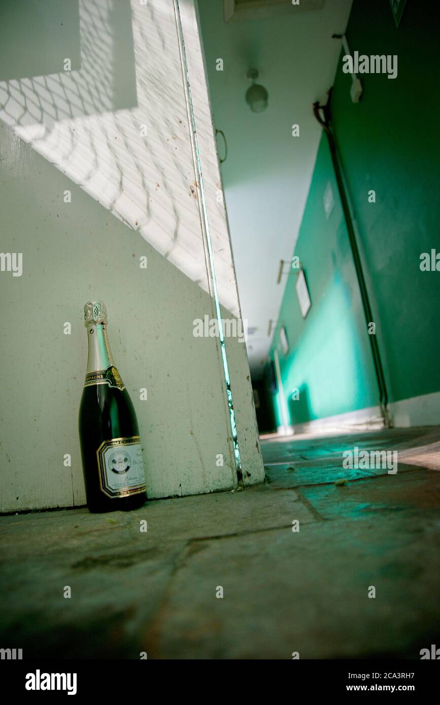 abandoned champagne bottle Stock Photo