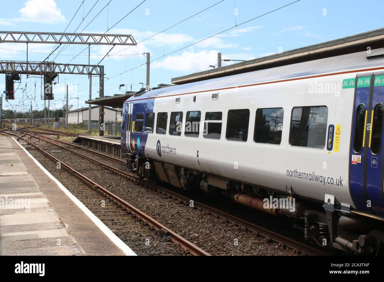 Class 158 express sprinter dmu in Northern livery at platform 2 with the Parliamentary train on 3rd August 2020 from Heysham Harbour to Lancaster. Stock Photo