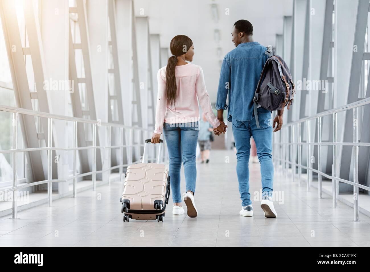 Romantic Black Couple Walking With Suitcases In Airport Terminal ...
