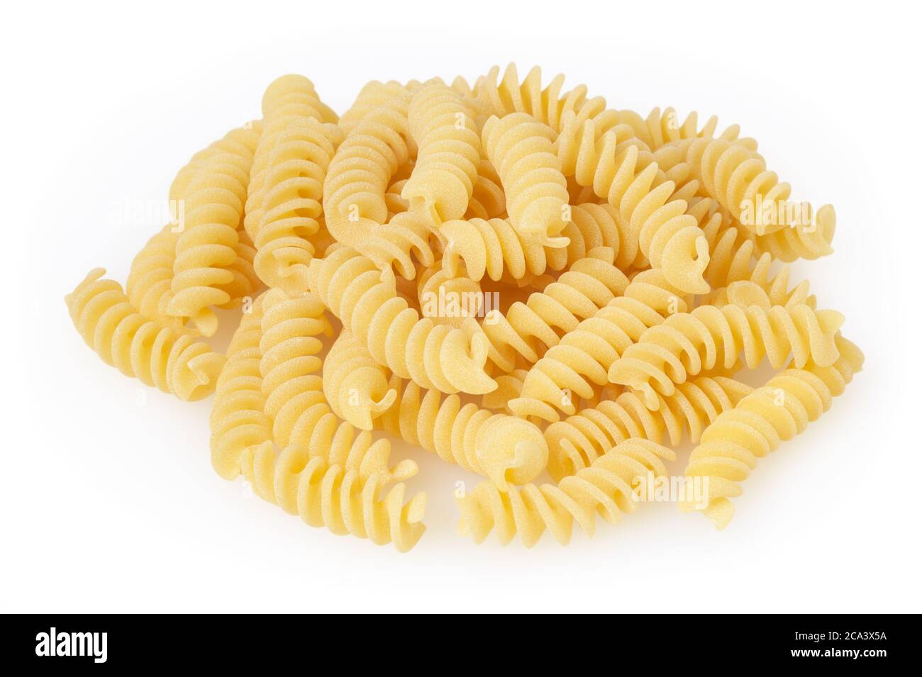 Uncooked fusilli pasta isolated on white background with clipping path Stock Photo