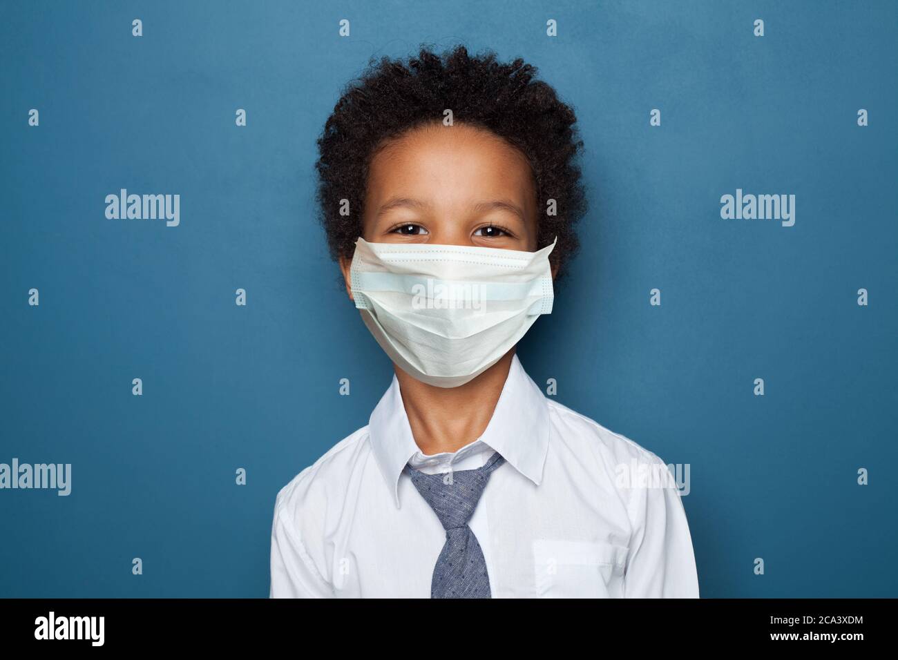 Portrait of cute black child boy in medical protective face mask Stock ...
