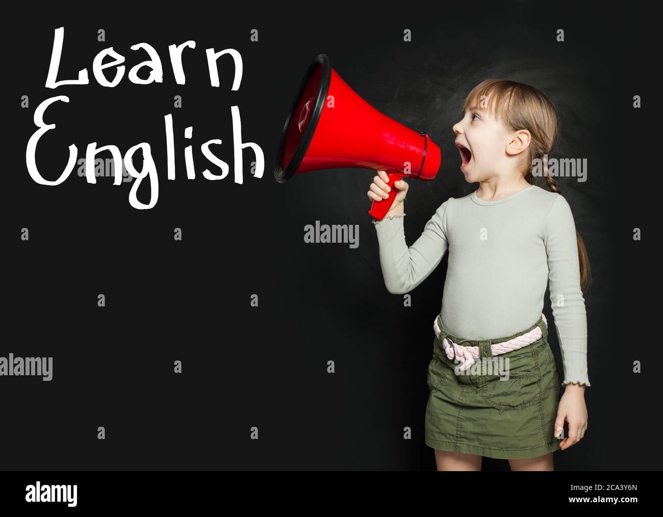 Child learning English language and screaming through a megaphone Learn