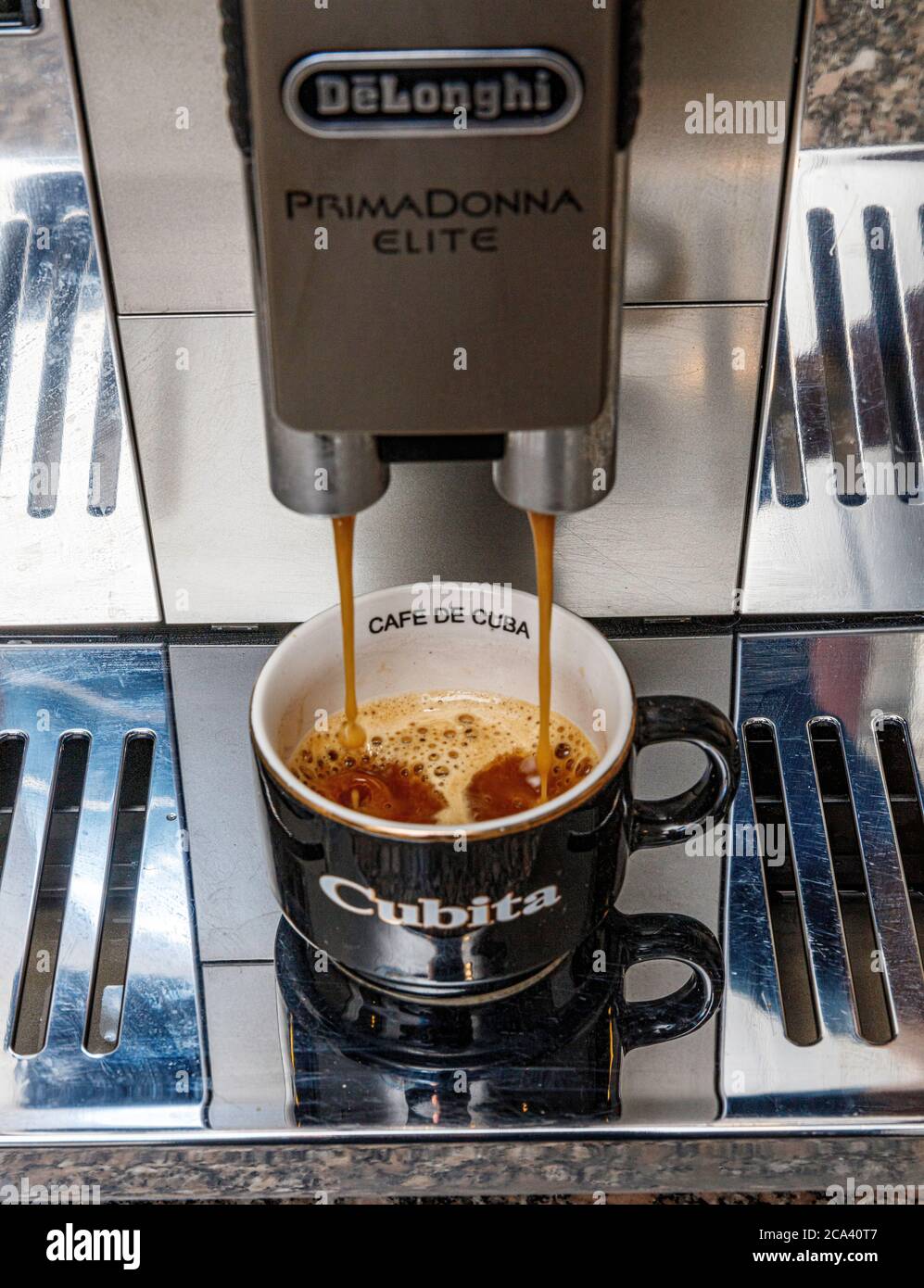 espresso home coffee making from DeLonghi Prima Donna Elite automatic bean to cup machine Stock Photo
