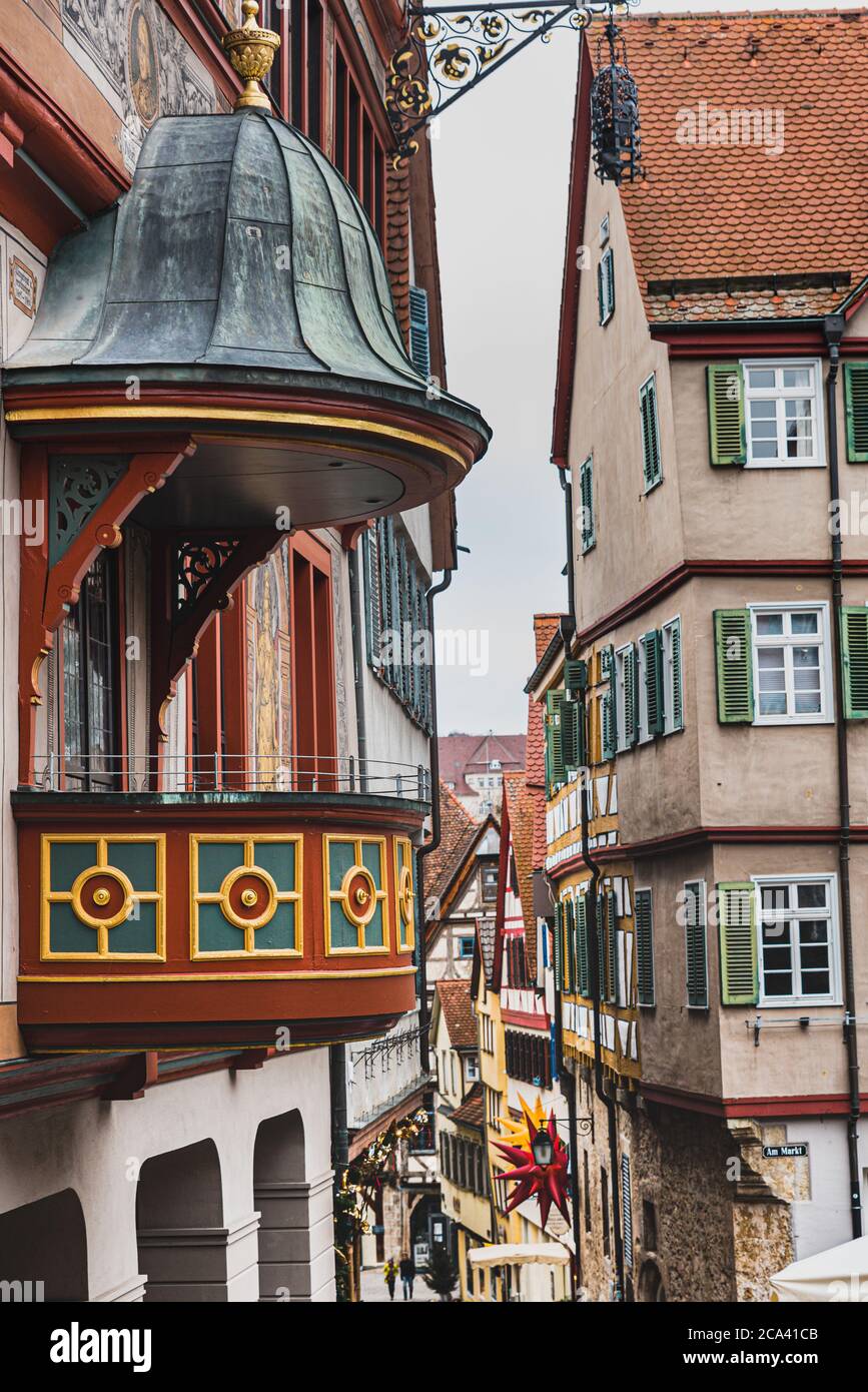 Tubingen Rathaus (Town Hall) and its small balcony with a narrow, medieval street in the Am Markt conveys an antique architectural housing style Stock Photo