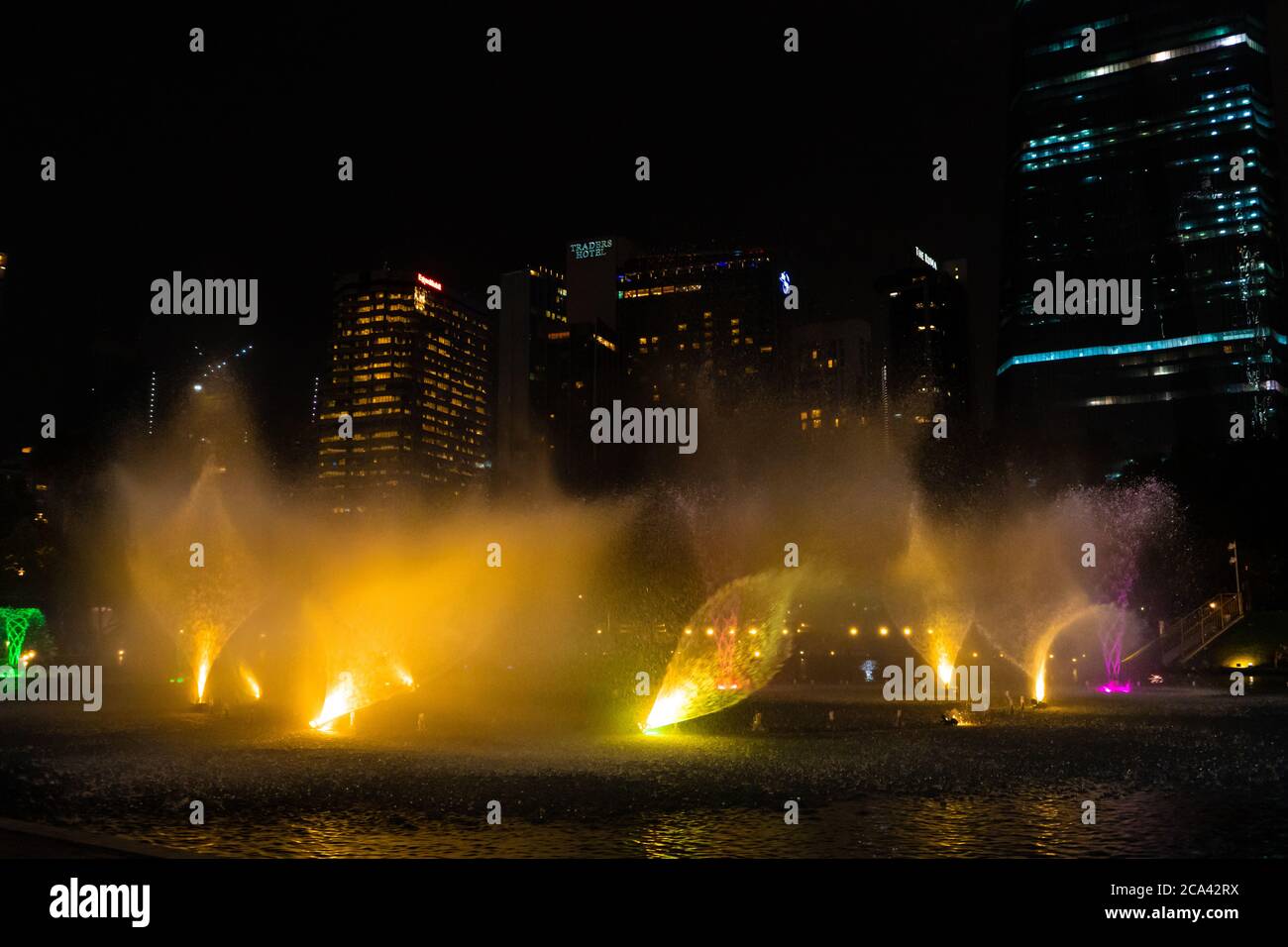 Night view of the dancing multi-colored fountains. Show of Singing Fountains. Stock Photo